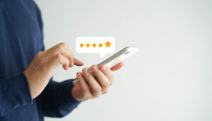 close up on customer man hand pressing on smartphone screen with five star rating feedback icon and press level good rank for giving best score point to review the service , technology business concept - Above The Bar - Above The Bar Male customer's hand pressing on smartphone screen with five-star rating - close up on customer man hand pressing on smartphone screen with five star rating feedback icon and press level good rank for giving best score point to review the service , technology business concept - Above The Bar - close up on customer man hand pressing on smartphone screen with five star rating feedback icon and press level good rank for giving best score point to review the service , technology business concept - Above The Bar